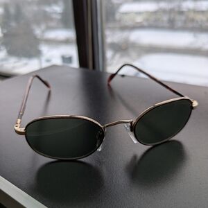 Stylish Black and Gold Oval Sunglasses